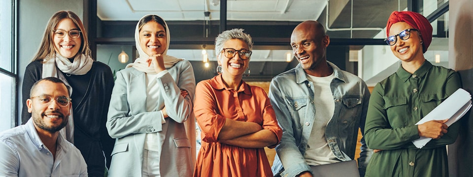 Diversity-Group of happy workers in office