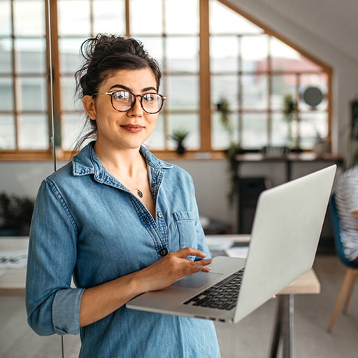 Smiling Gen Z worker in creative office